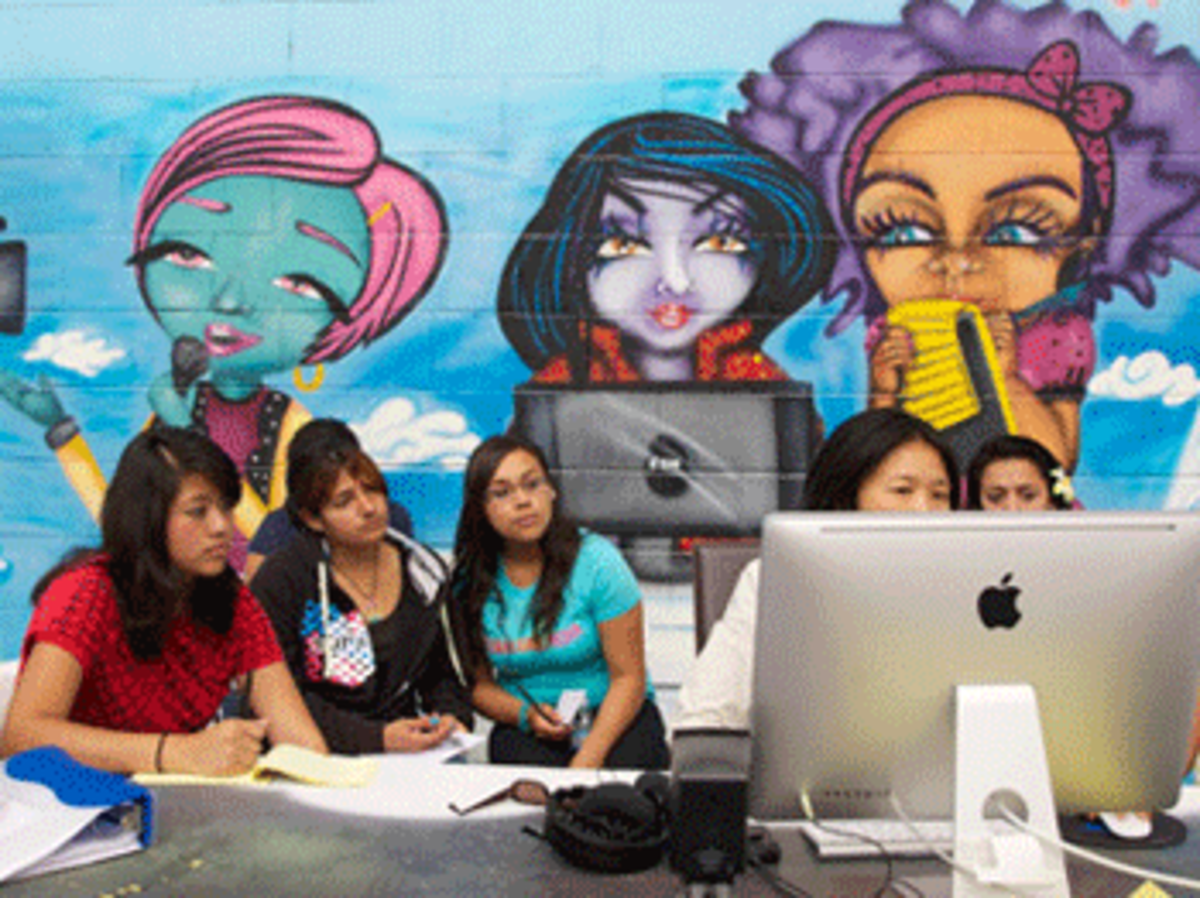 Editor Ann Kaneko teaches the girls how to shape their stories.
