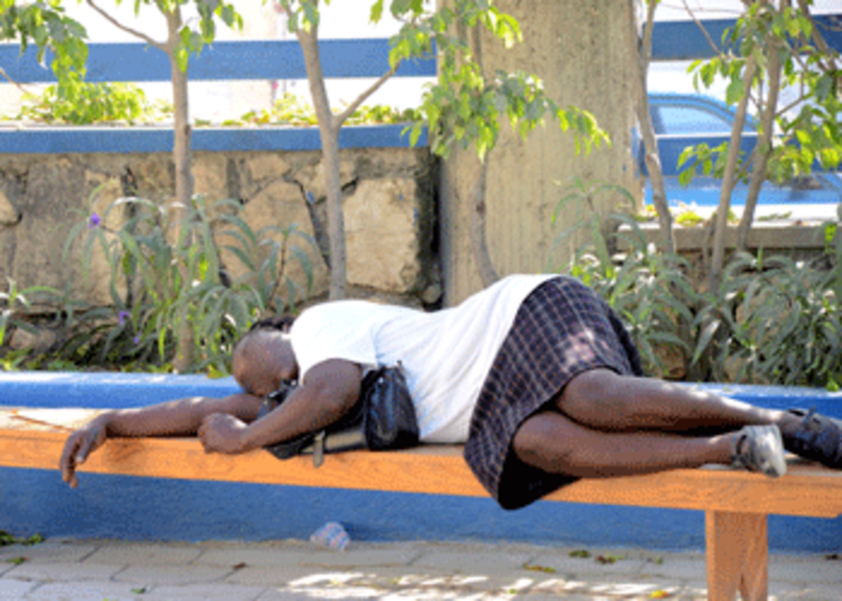 haiti_woman_bench haiti woman bus bench