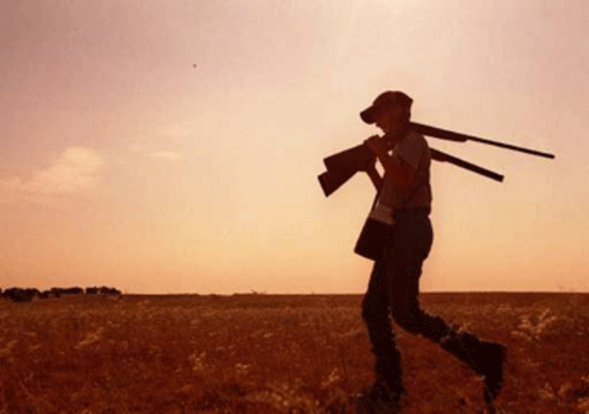 boy with shotguns