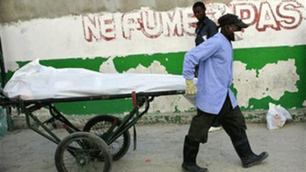 A dead body is transported from the cholera pavilion at a general hospital Port-au-Prince November 21, 2010. Credit: Reuters/Kena Betancur