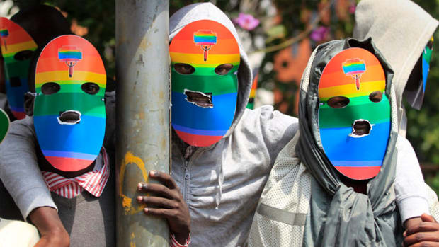 Masked Kenyan supporters of the LGBT community stage a protest against Uganda's anti-gay bill in Nairobi. Ugandan President Yoweri Museveni has been warned by President Obama that signing an anti-gay law would "complicate" the U.S. relationship with the east African country. (Dai Kurokawa / EPA )