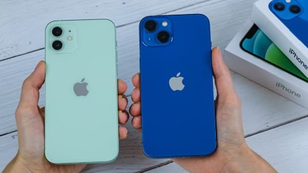 iPhone 13 in blue and iPhone 12 in green. Manhattan, New York, USA September 25, 2021.