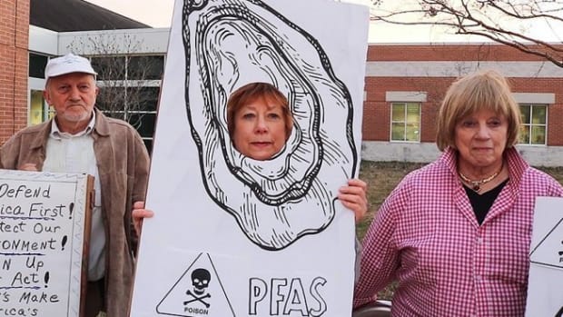 Environmental activists greet 300 Maryland residents on March 3, 2020 as they entered an open house by the Navy to address PFAS contamination in local waterways.  - Bev Bank, E & E News
