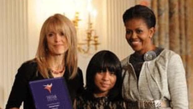Harmony Projects founder Margaret Martin and seventh-grader Kiana Coronado-Ziadie receive an award from First Lady Michelle Obama. (Photo Credit: White House)