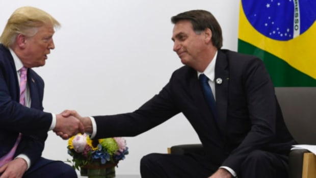 President Donald Trump, left, shakes hands with Brazilian President Jair Bolsonaro, right, during a bilateral meeting on the sidelines of the G-20 summit in Osaka, Japan, Friday, June 28, 2019. (AP Photo/Susan Walsh)