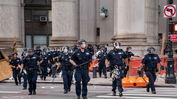 Police officers approach protesters near City Hall on July 1, 2020, in New York City.