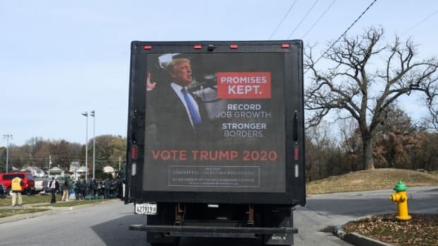 DES MOINES, IA - NOVEMBER 09: A mobile billboard, displaying an advertisement for President Donald Trump's 2020 campaign, drives around outside the Climate Crisis Summit at Drake University on November 9, 2019 in Des Moines, Iowa. Democratic presidential candidate Sen. Bernie Sanders (I-VT) and U.S. Rep. Alexandria Ocasio-Cortez (D-NY) will be speaking at the event. (Photo by Stephen Maturen/Getty Images)