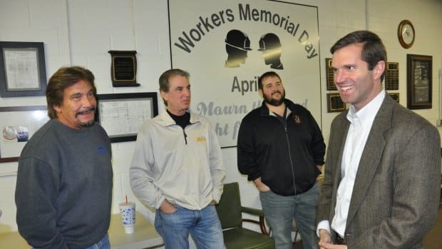 Governor-Elect Andy Beshear talking to union members, from left, Jim Key, Barry Davis and Alton Cunningham III