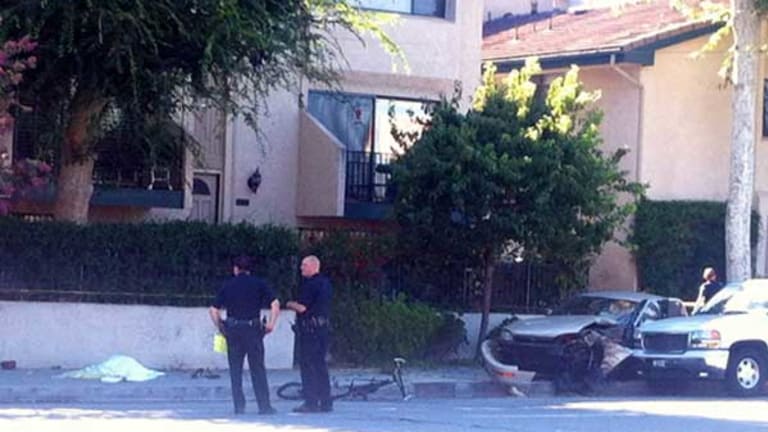 Bicyclist Dies in Macabre Accident, Run Down on the Sidewalk by a Car