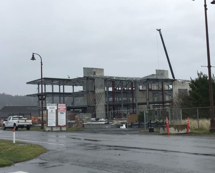 Photo credit: The OSU Marine Science building under construction, April 2019. It’s on a sandbar at sea level in Newport, Ore., and can be overtopped by the largest of the modeled tsunamis, as well as battered by the NOAA ships docked just to the left out of the frame. It’s not often you can take the “after” picture ahead of time, but this is what it may look like after being destroyed by the next tsunami. Credit: Chris Goldfinger.