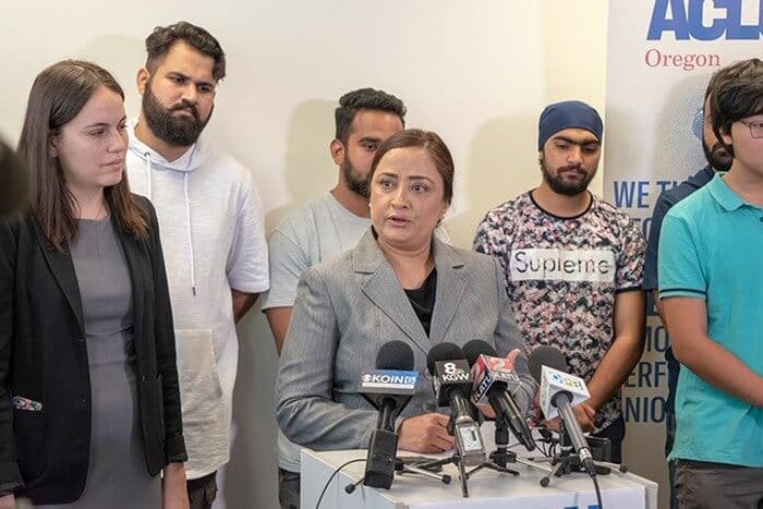 Interpreter Navneet Kaur speaks at a September news conference in Salem, Ore., after eight South Asian asylum seekers who were locked up in a federal prison were released. (Doug Brown / Portland Mercury)