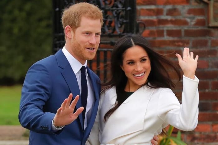 Britain's Prince Harry and his fiancee Meghan Markle pose for photographers during a photocall in the grounds of Kensington Palace in London, Monday Nov. 27, 2017. Britain's royal palace says Prince Harry and actress Meghan Markle are engaged and will marry in the spring of 2018. (AP Photo/Matt Dunham)
