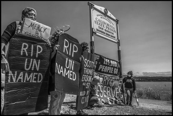 While the names of some of the San Quentin prisoners who have died are public, others are not. Participants held tombstones in their memory nevertheless.