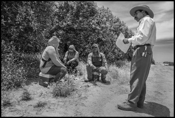 Aquiles Hernandez, an indigenous Mixtec farmworker and former teacher activist in Mexico, informs Mixtec-speaking workers at Gourmet Trading about their labor rights during a lunchtime access period in 2016.