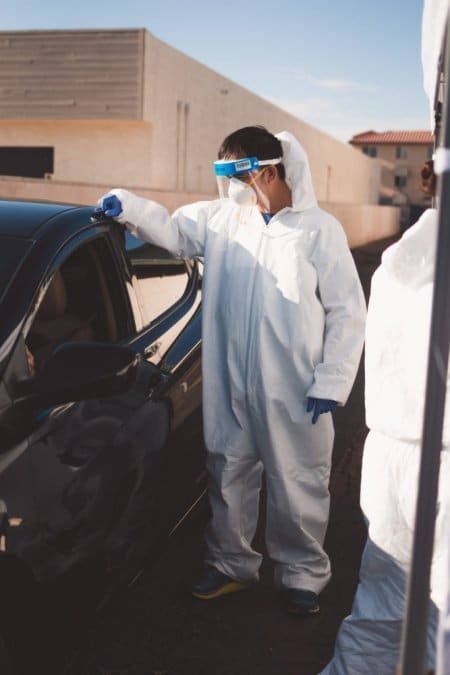 Dr. Tien Vo helps conduct drive-through COVID-19 testing outside his Calexico clinic. Photo by Rachel Avalos.