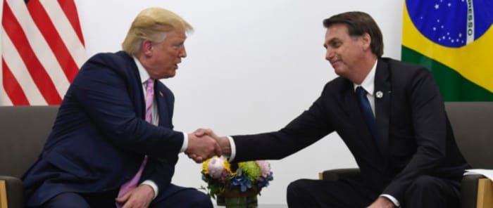 President Donald Trump, left, shakes hands with Brazilian President Jair Bolsonaro, right, during a bilateral meeting on the sidelines of the G-20 summit in Osaka, Japan, Friday, June 28, 2019. (AP Photo/Susan Walsh)