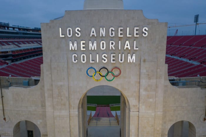 LOS ANGELES, CA - JUNE 12: A drone aerial view shows the Los Angeles Memorial Coliseum at Exposition Park as Los Angeles County allows more businesses and facilities to reopen today, despite rising COVID-19 infections and deaths on June 12, 2020 in Los Angeles, California. After reporting the county’s largest single-day jump in coronavirus cases, health officials are warning that the county’s transmission rate of the disease could overwhelm intensive-care units in the next two to four weeks if the increase isn't reversed. Newly allowed reopenings include gyms and fitness facilities, spectator-free sports venues, day camps, museums, galleries, zoos, aquariums, campgrounds, RV parks, outdoor recreational areas including swimming pools, music, film and television production and hotels for leisure travel. The county's death toll is currently more than 2,800 with the total number of cases nearing 69,000. (Photo by David McNew/Getty Images)
