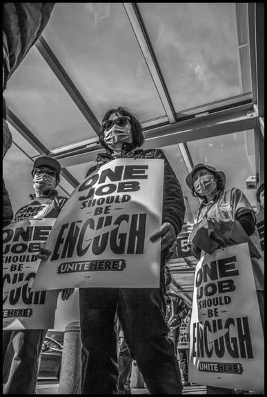 Airline kitchen workers, members of UNITE HERE Local 2, picket at the American Airlines terminal at San Francisco International Airport.