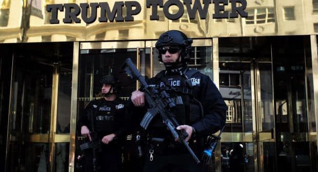 New York Police Department (NYPD) officers guard the main entrance of the Trump Tower in New York on November 14, 2016. By Jewel Samad AFP/Getty Images.