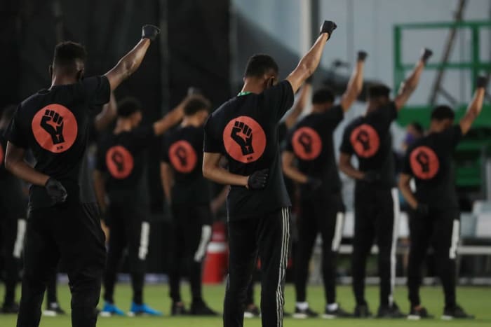 REUNION, FLORIDA - JULY 08: Players of MLS teams participate in a Black Lives Matter pre-game ceremony before match between Orlando City and Inter Miami as part of MLS is back Tournament at ESPN Wide World of Sports Complex on July 08, 2020 in Reunion, Florida. (Photo by Mike Ehrmann/Getty Images)