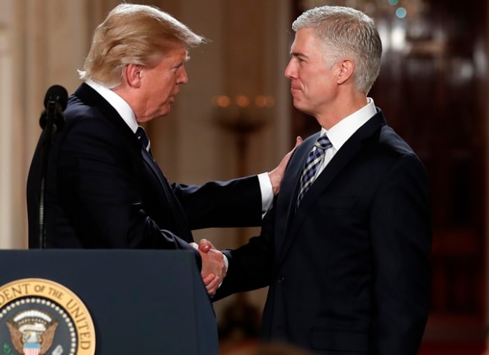 President Donald Trump shakes hands with 10th U.S. Circuit Court of Appeals Judge Neil Gorsuch, his choice for Supreme Court Justices in the East Room of the White House in Washington, Tuesday, Jan. 31, 2017. (AP Photo/Carolyn Kaster)