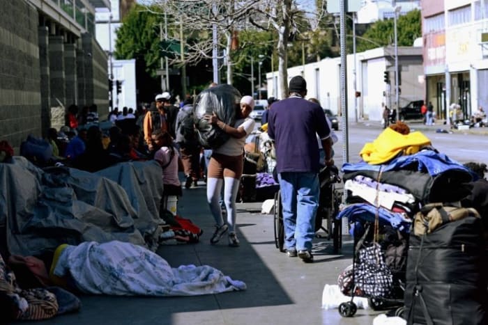 LOS ANGELES, CA - FEBRUARY 28: Homeless people rest on a public sidewalk February 28, 2013 in downtown skid row area of Los Angeles, California. Los Angeles officials will ask U.S. Supreme Court to overturn a lower-court ruling preventing the destruction and random seizures of belongings that homeless people leave temporarily unatteneded on public sidewalks. The lower court ruling has hindered cleanup efforts. (Photo by Kevork Djansezian/Getty Images)
