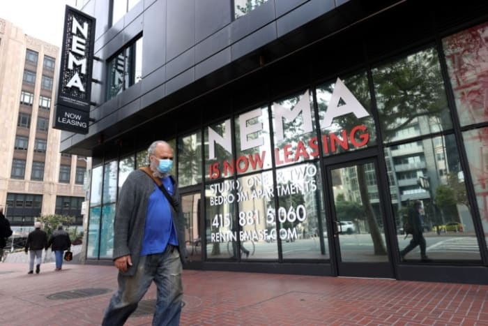 SAN FRANCISCO, CALIFORNIA - SEPTEMBER 01: A pedestrian walks by a building advertising apartment leases on September 01, 2020 in San Francisco, California. San Francisco rental prices have dropped nearly 15 percent in the past year as residents begin moving away from the city. (Photo by Justin Sullivan/Getty Images)
