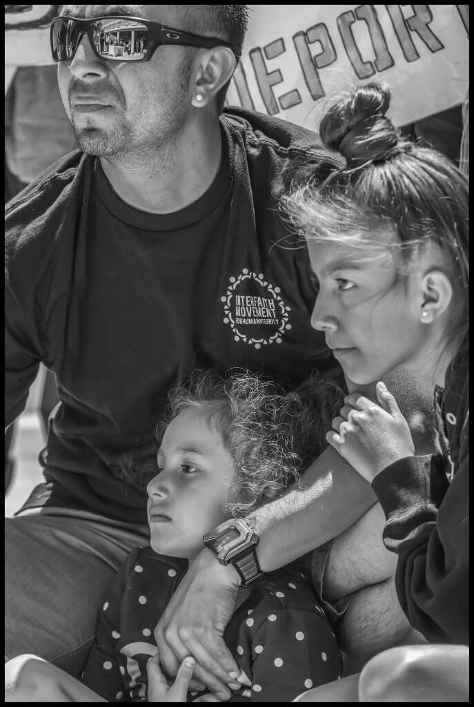 Supporters of Lourdes Barraza and her husband Fernando were able to raise the bond to get him released. He came to the next vigil to show support for other families, holding his youngest daughter.