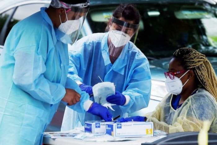 Health workers give people free Covid-19 tests in Arlington, Virginia, on May 26. Olivier Douliery/AFP via Getty Images.