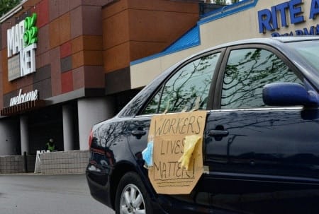 Community groups and labor unions organize a car caravan through Brattleboro, Vt., to show solidarity with essential workers and lift up calls for crisis responses that focus on workers’ health and welfare on May 1, 2020. | Kristopher Radder / The Brattleboro Reformer / AP