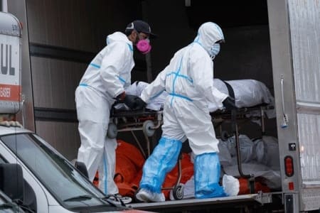 The bodies of some of the lost souls are loaded into a refrigerated truck in New York City, April 29, 2020. | Craig Ruttle / AP