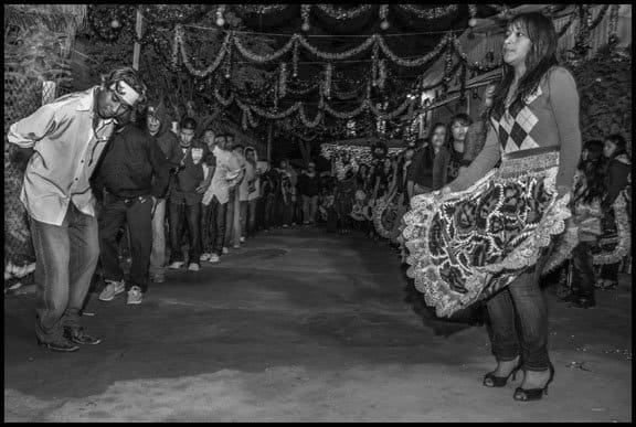 COACHELLA VALLEY, CA - 6DECEMBER10 - Members of the Purepecha community in the Coachella Valley gather at night to rehearse the Danza de Los Ancianos (the Dance of the Old People), preparing to perform it during a procession celebrating the Virgin de Guadalupe. This is also an opportunity to teach children the dance and musci traditions of the community. Purepechas are the main indigenous group in the Mexican state of Michoacan. Many Purepechas live in the Duros and Chicanitas trailer camps in the desert near the Salton Sea, on the Torres Martinez Reservation, and work as farm workers in the fields of the Coachella Valley.Copyright David Bacon