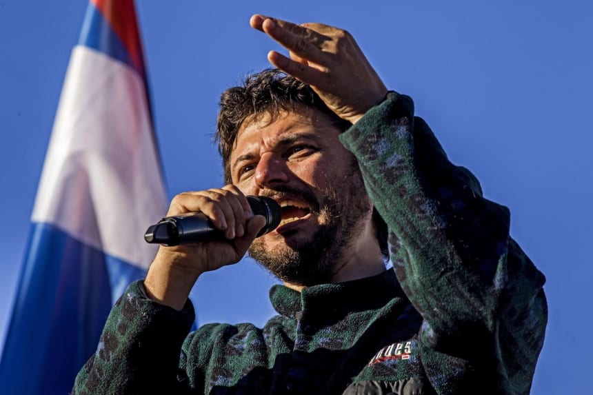 Juan Grabois speaks during a drive in Buenos Aires to support the occupation of a property in the Entre Ríos province in October 2020. Photo ZUMA Press, Inc. via Alamy