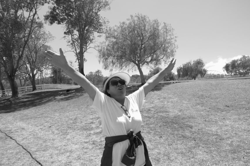 Leonor sings with joy as Sunday service is held at a park to celebrate the 4th of July. Leonor has found some momentary reassurance with the current block on Hugo’s case. July 3, 2022. Photo by Zaydee Sanchez for palabra