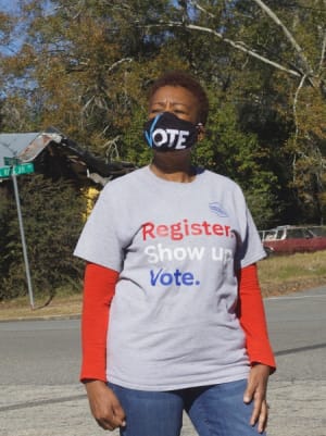 Barbara McDuffie, a member of Organizing for Grady County, stands in the town of Cairo where some residents say their monthly electricity bills are $350 or more.