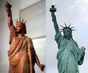 The statue on the left is a copy of an early version of the statue with chains in hand