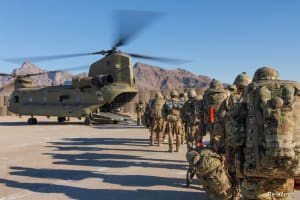 Soldiers attached to the 101st Resolute Support Sustainment Brigade, Iowa National Guard and 10th Mountain, 2-14 Infantry Battalion, load onto a Chinook helicopter to head out on a mission in Afghanistan, January 15, 2019. 1st Lt. Verniccia Ford/U.S. Army/Handout via REUTERS ATTENTION EDITORS - THIS IMAGE WAS PROVIDED BY A THIRD PARTY. - RC110D3B25B0