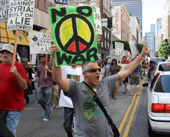 After rallying in Pershing Square, anti-war demonstrators began marching through downtown. (Dan Bluemel / LA Activist)
