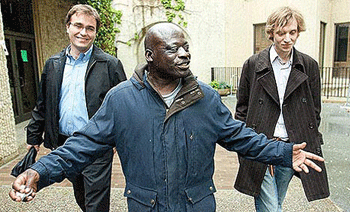 Norman Williams, center, with Mark Melahn, left, and Jesse Goodman, who worked on his case while in law school. Williams was sentenced to 25 years to life after his third-strike conviction, which was for stealing a car jack and tools from a tow truck. Through the efforts of Stanford's Criminal Defense Clinic, his sentence was reduced to 10 years. He had already served more than that so was freed. (Photo courtesy of Los Angeles Times)