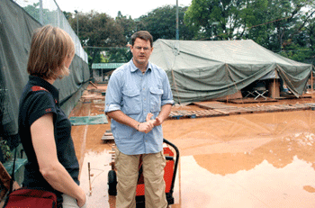 Wilson and Keenan at flooded camp area in Petionville. Haitians refer to this camp as the the "Club Med" of camps.