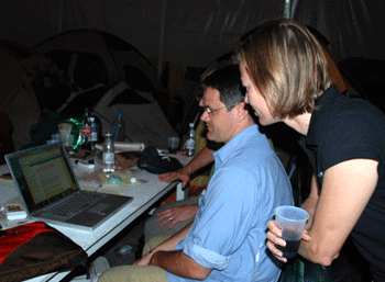 Image: Dr. Keenan discussing the possibilities of social networking with bio-surviellance expert Jim Wilson