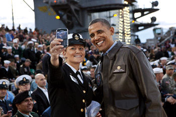 President Barack Obama has his picture taken on the USS Carl Vinson, Nov. 11, 2011. (Official White House Photo by Pete Souza)