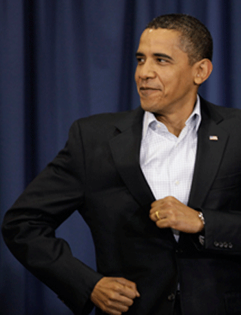 President Barack Obama jogs in to speak at a town hall meeting on health care in Belgrade, Mont. Friday, Aug. 14, 2009.(AP Photo/Alex Brandon)