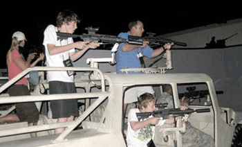 Youth and adults enjoy the killing games at the Army Experience Center at Franklin Mills Mall in Philadelphia.
