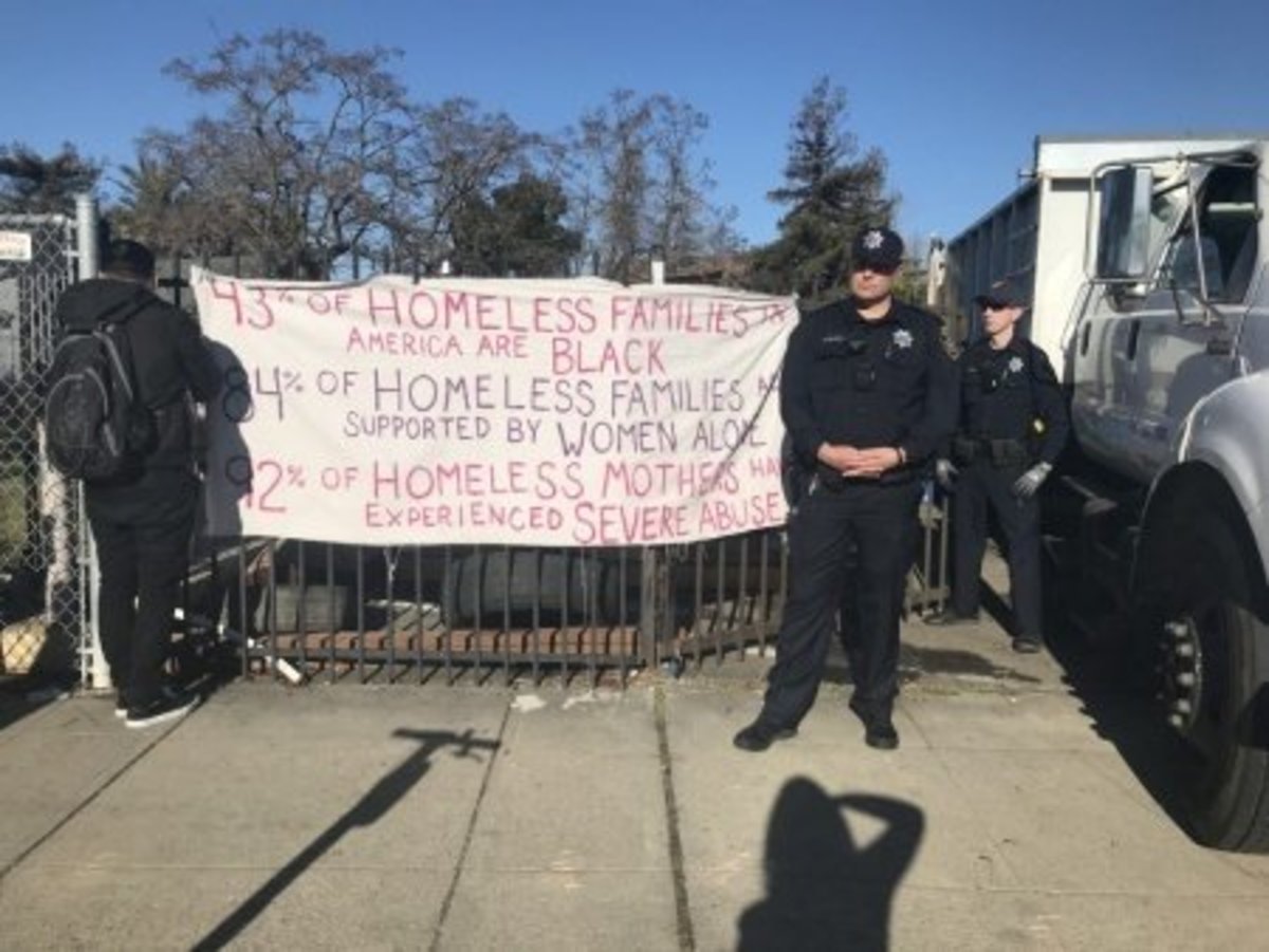 A Housing and Dignity Village encampment being torn down in Oakland in December 2018. (Alastair Boone)