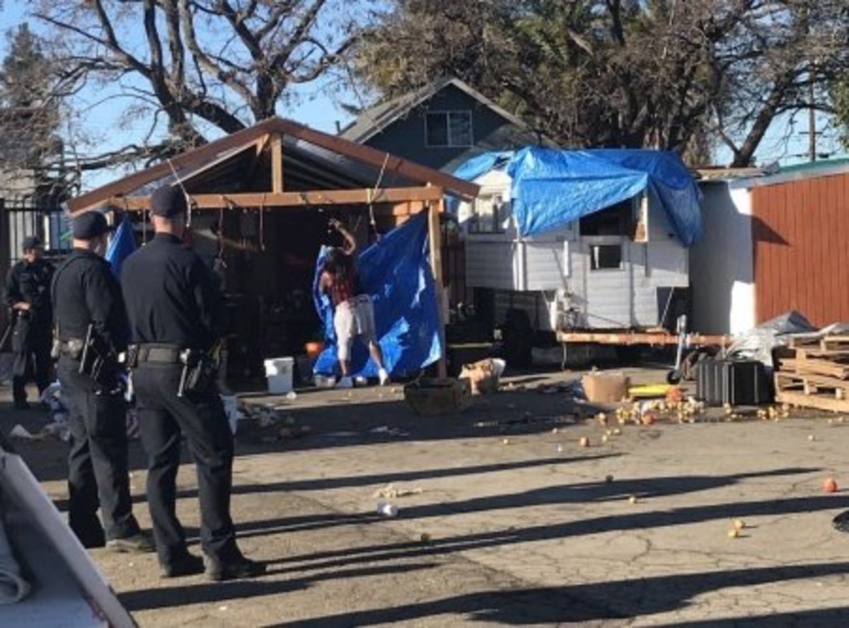 Housing and Dignity Village encampment being torn down in December 2018. (Alastair Boone)
