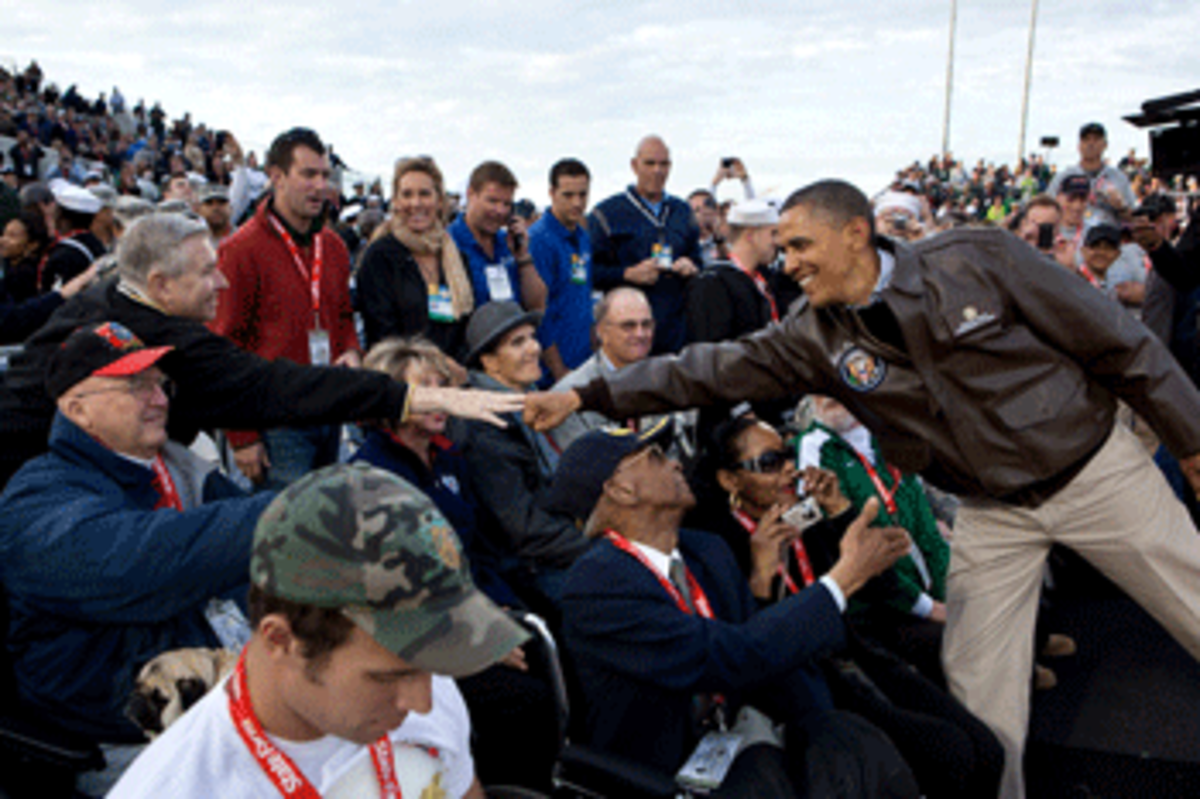 President Barack Obama greets veterans before the Carrier Classic basketball game between the University of North Carolina Tar Heels and Michigan State Spartans on the flight deck of the USS Carl Vinson, docked at North Island Naval Station in San Diego, Calif., Nov. 11, 2011. (Official White House Photo by Pete Souza)