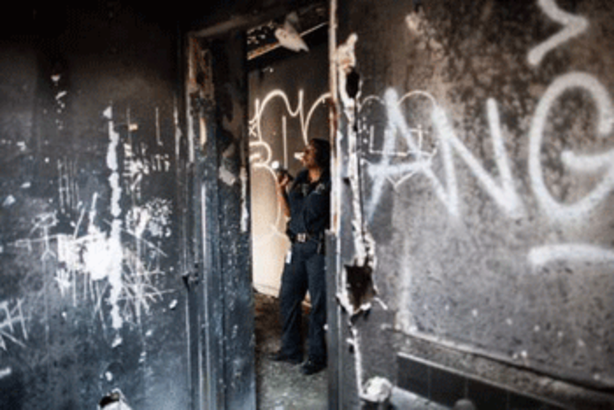 When a house sits empty, vagrants find their way in. Code enforcement officer Eva Mann says she often finds trash, graffiti, and a whole lot worse. Photo by Matthew Ryan Williams for Equal Voice News
