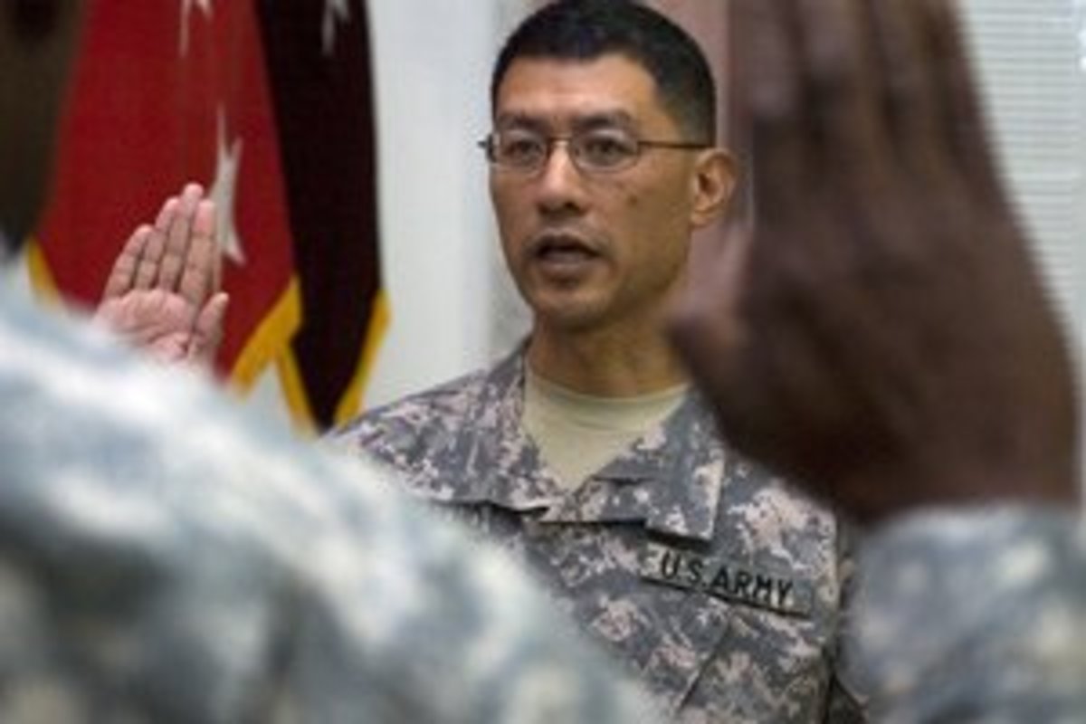 Brig. Gen. Joseph Caravalho, reaffirms his oath as an officer on July 28, 2008, following his promotion to his current rank at the Al-Faw Palace, Camp Victory, Baghdad.