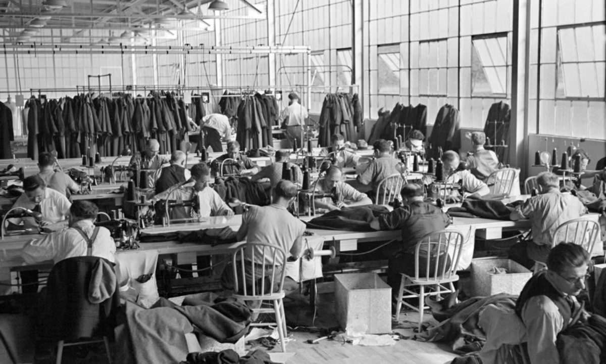 Homesteaders, relocated by the U.S. Resettlement Administration, a federal agency under the New Deal, working at a cooperative garment factory in Hightstown, New Jersey, in 1936. The U.S. Resettlement Administration relocated struggling families to provide work relief. Photo by Universal History Archive/Universal Images Group/Getty Images.